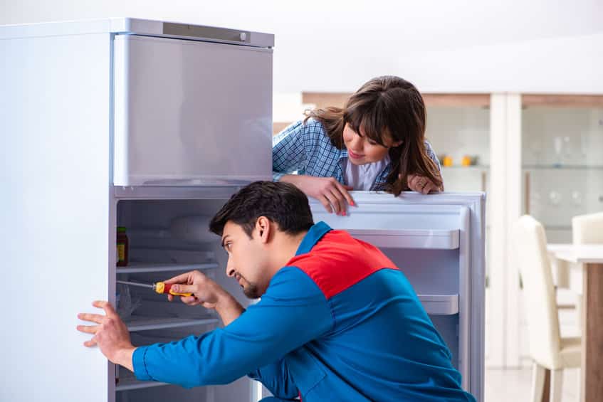 Refrigerator repair in progress